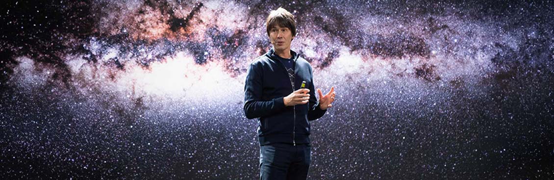 Brian Cox speaking on stage