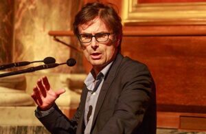 Robert Peston speaking on stage