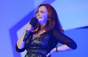 Lucy Porter on stage.