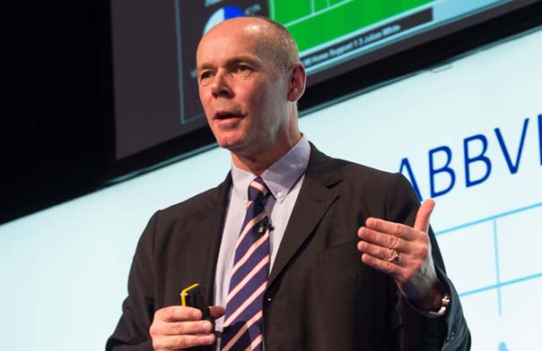 Clive Woodward speaking on stage.