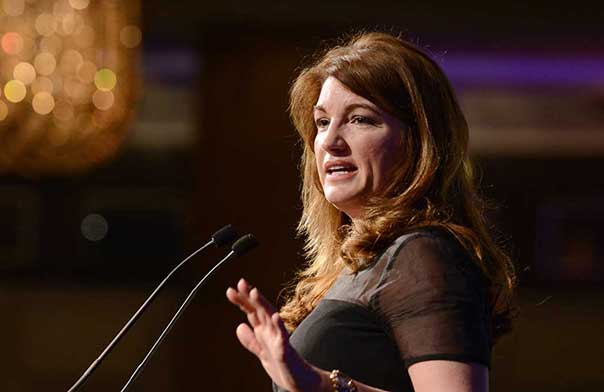 Karren Brady speaking on stage,