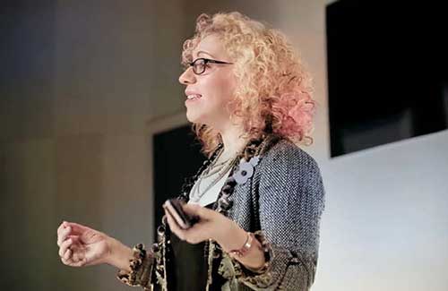 Blaire Palmer speaking on stage.