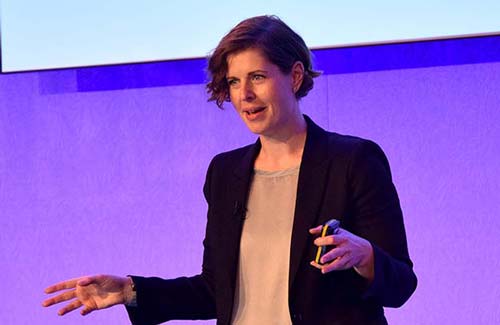 Lindsay Herbert speaking on stage.