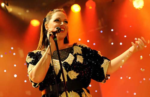 Natalie Williams performing on stage.