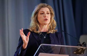 Penny Mordaunt speaking on stage.