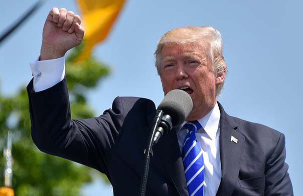 Donald Trump speaking on stage.