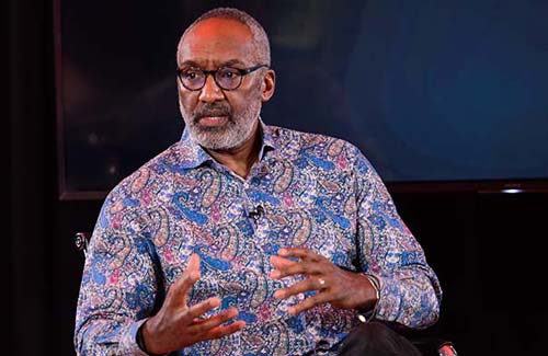 Leroy Logan speaking on stage.