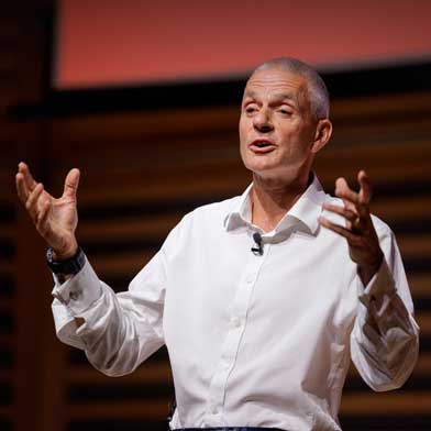 Tim Davie speaking on stage
